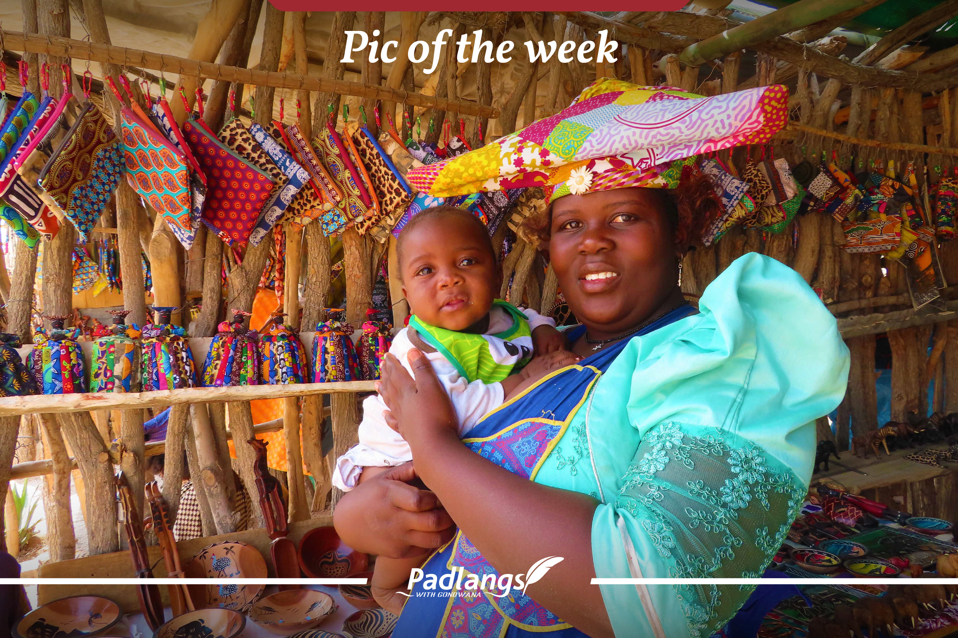 Herero woman in traditional attire with baby, Namibia