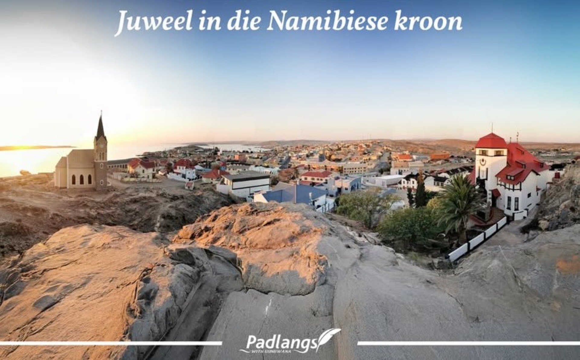 View of Lüderitz harbour in Namibia with colonial buildings, colorful waterfront, and the surrounding desert
