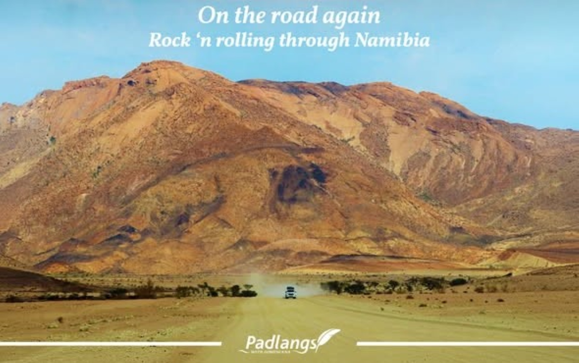 Brandberg massif rising above the desert landscape, encountered on a road trip from Twyfelfontein through Damaraland toward the coast near Swakopmund.