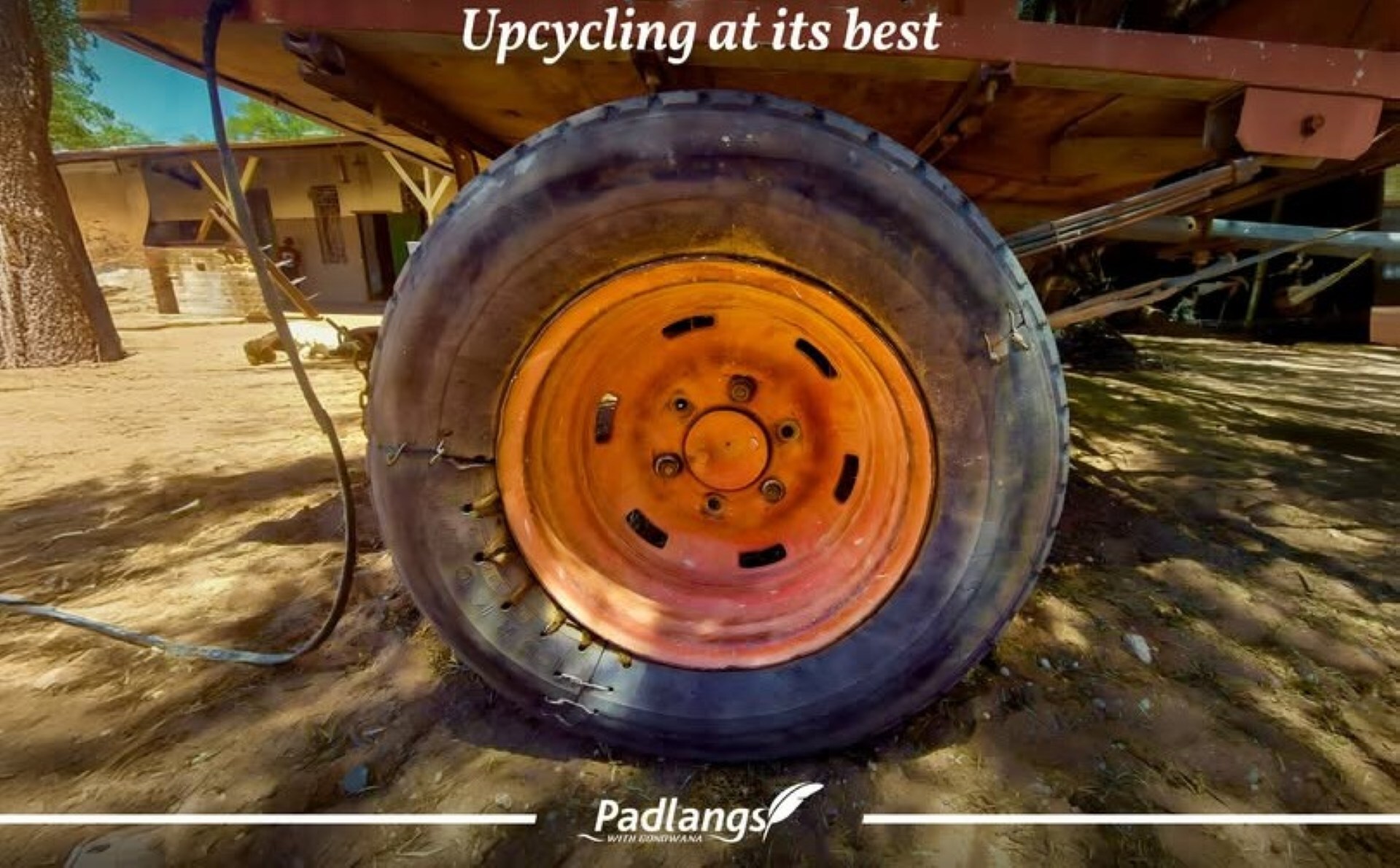 An old donkey cart tyre repaired with wire, cloth and grass shows rural ingenuity, extending its life through a clever tubeless-style fix.